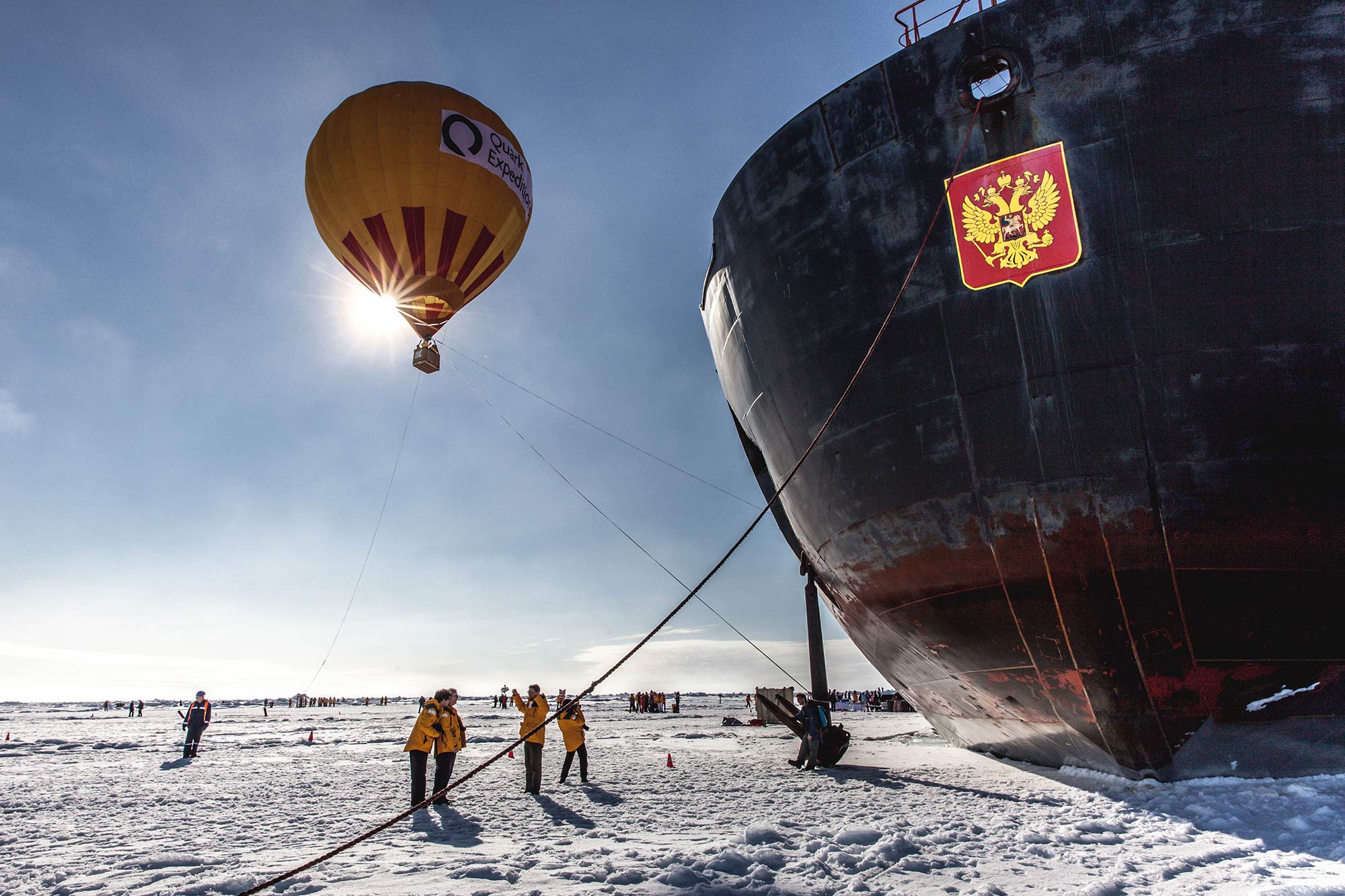 Arctic landscape with passengers, hot air balloon and 50 Years of Victory