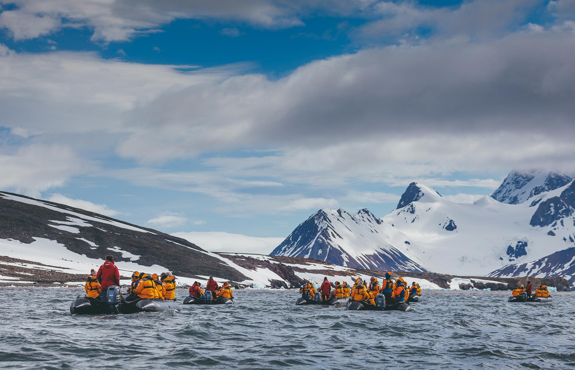 Multiple Zodiacs cruising in the Arctic