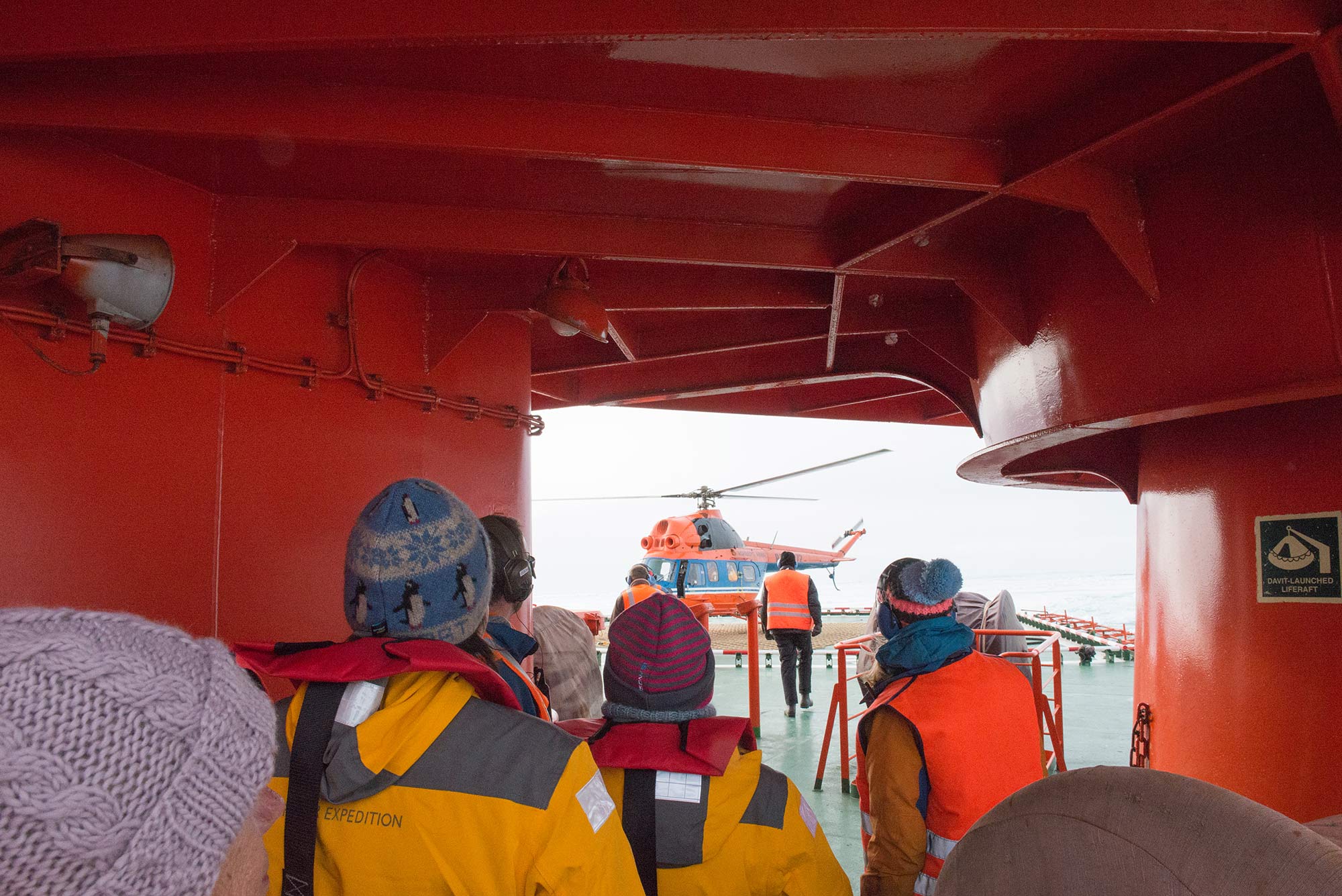 Passengers walking towards helicopter