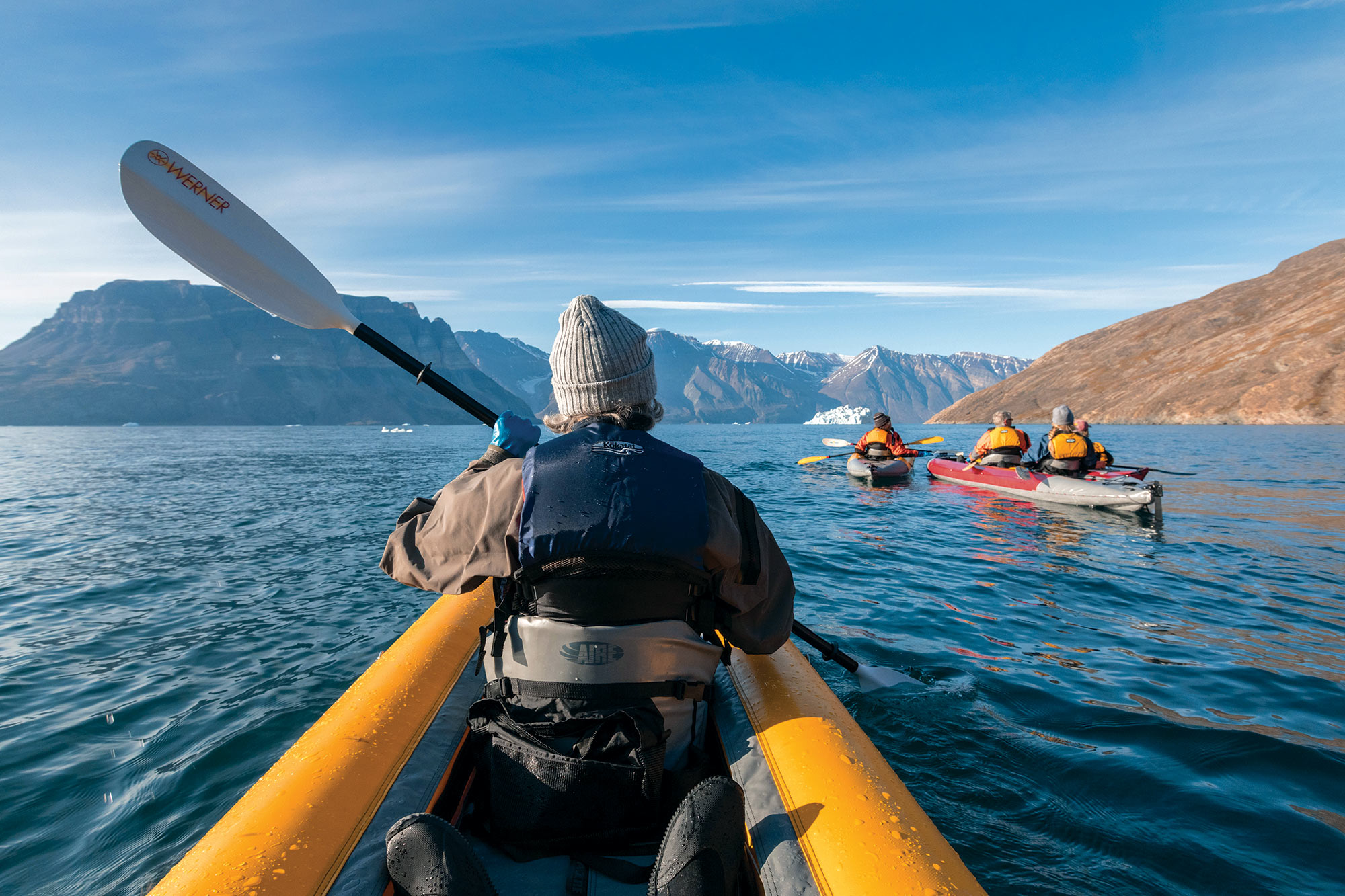 Backseat POV of passenger on paddling excursion in the Arctic